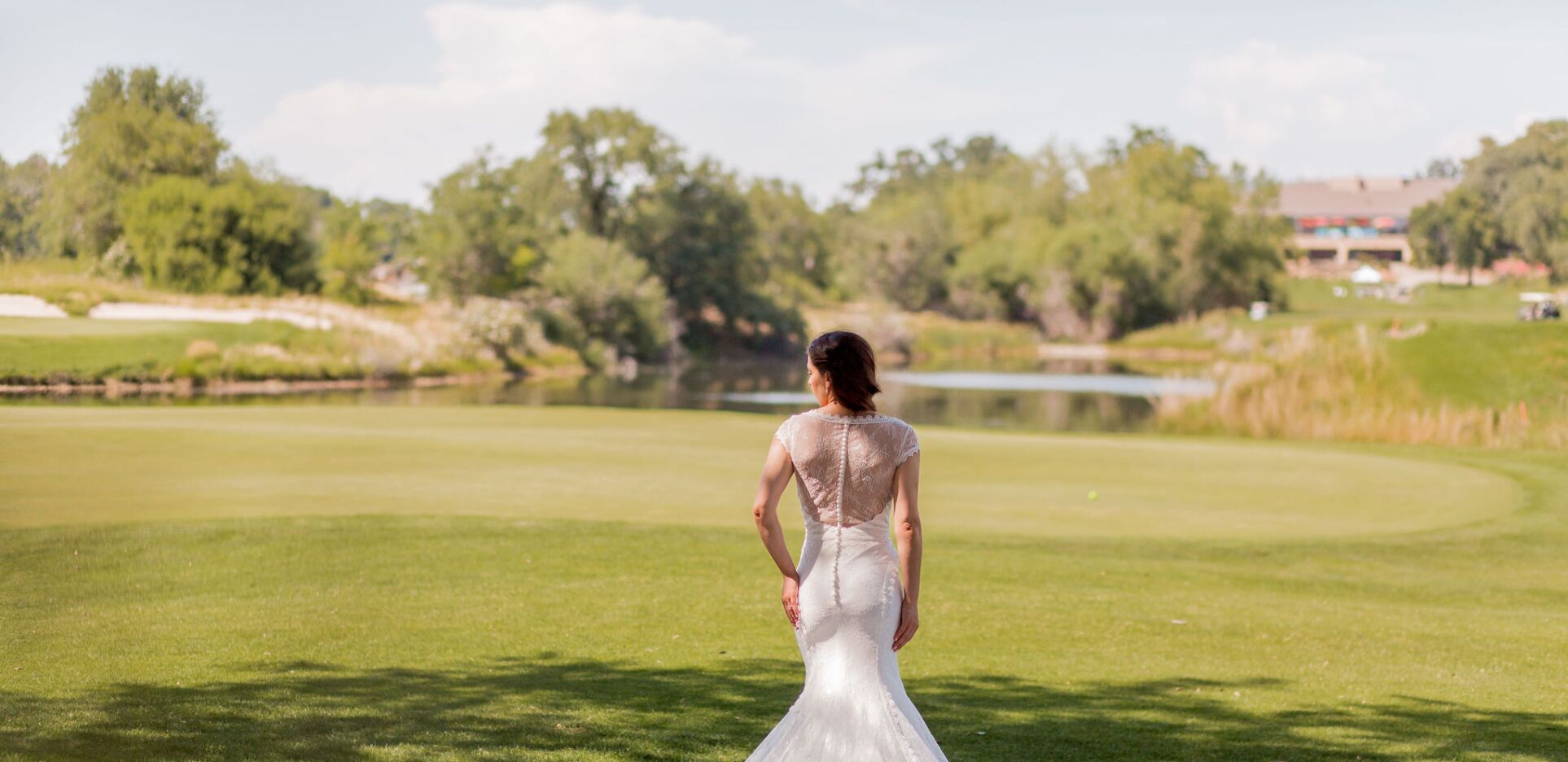 Bride in gown on golf course