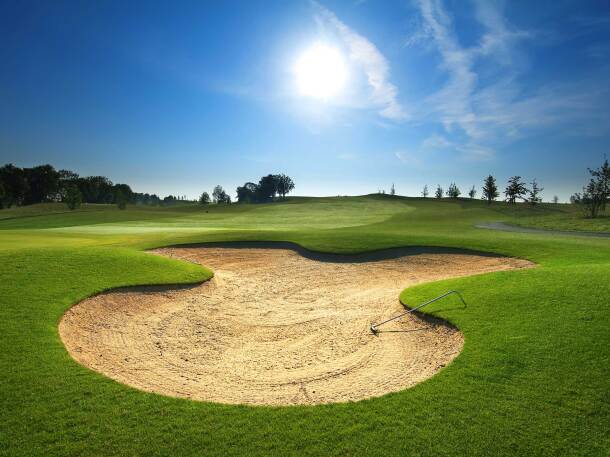 View of golf course with bunker